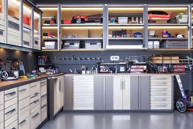 an image of a well-organized, spacious garage with various types of cabinets, including wall-mounted cabinets, mobile cabinets with wheels, overhead cabinets, and a workbench integrated into the cabinet setup. The garage should exude a sense of neatness, efficiency, and innovative use of space.